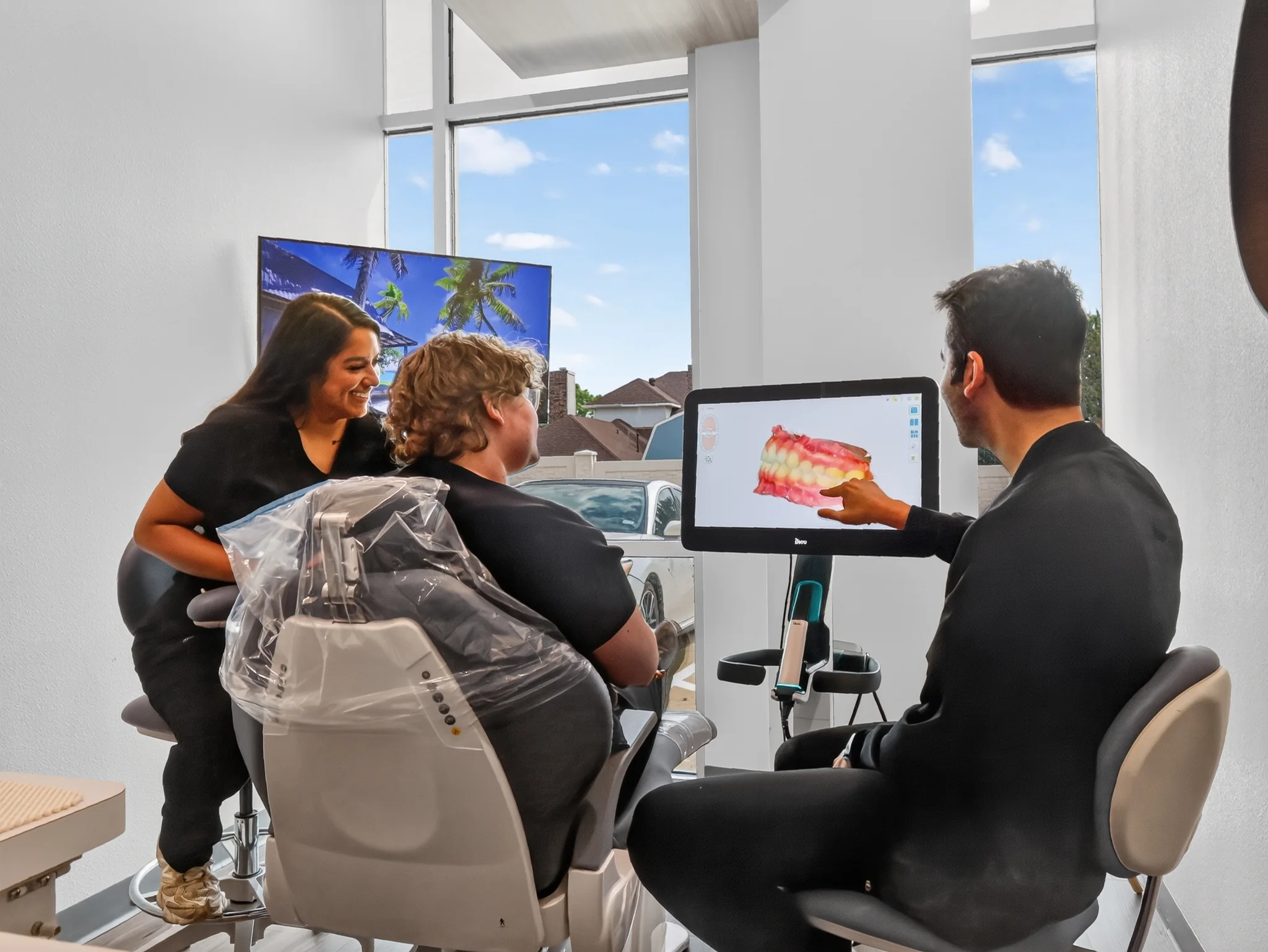 Fresh 32 Family Dentistry team reviewing a digital dental scan with a patient