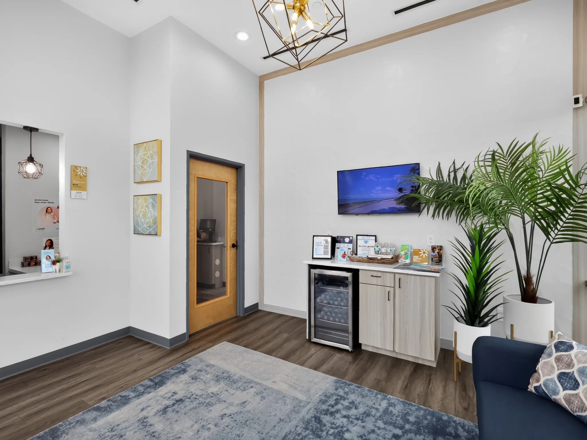 Lobby amenities, seating, and wall-mounted TV at Fresh 32 Family Dentistry